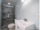Well-lit bathroom with a tiled walk-in shower and a sleek vanity, offering functionality and style at 1934 Hickory Hills Dr, Denver, NC 28037