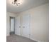 Simple bedroom with three doors at 1934 Hickory Hills Dr, Denver, NC 28037