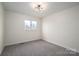 Simple bedroom with neutral walls and carpet flooring at 1934 Hickory Hills Dr, Denver, NC 28037