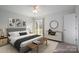 Bright bedroom featuring a comfortable bed, contemporary decor, and access to an outdoor deck at 1934 Hickory Hills Dr, Denver, NC 28037
