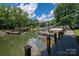 Beautiful waterfront property with a private dock and boats on a peaceful lake setting at 1934 Hickory Hills Dr, Denver, NC 28037