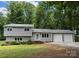 Charming two-story home with a well-maintained front yard and attached two-car garage at 1934 Hickory Hills Dr, Denver, NC 28037