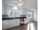 Modern kitchen with white cabinets and stainless steel appliances at 1934 Hickory Hills Dr, Denver, NC 28037