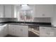 Well-lit kitchen features stainless steel appliances and gray backsplash at 1934 Hickory Hills Dr, Denver, NC 28037