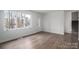 Spacious living room with hardwood floors and access to stairs at 1934 Hickory Hills Dr, Denver, NC 28037