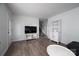 Spacious living room with hardwood floors, staircase, entertainment center, and stylish furniture at 1934 Hickory Hills Dr, Denver, NC 28037