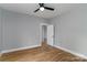 Bright bedroom featuring wood flooring, modern ceiling fan, and neutral paint at 2657 Polo Ln, Maiden, NC 28650