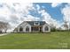 Inviting single-Gathering home with white siding and black shutters, complemented by a lush green lawn at 2657 Polo Ln, Maiden, NC 28650
