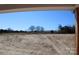 View from home showcasing fenced pasture and horse barn, highlighting equestrian potential at 2657 Polo Ln, Maiden, NC 28650