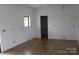 Well-lit kitchen area with a window and doorway to a pantry at 2657 Polo Ln, Maiden, NC 28650