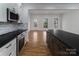 Modern kitchen featuring stainless steel appliances, a stylish island, and white cabinets offering a contemporary design at 2657 Polo Ln, Maiden, NC 28650