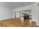 Open-concept living space flows into the kitchen, featuring hardwood floors and recessed lighting at 2657 Polo Ln, Maiden, NC 28650