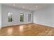 Bright living room boasts hardwood floors, natural light, and neutral color palette at 2657 Polo Ln, Maiden, NC 28650