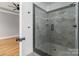 Beautifully tiled walk-in shower featuring a glass enclosure and modern fixtures at 2657 Polo Ln, Maiden, NC 28650