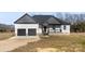 Beautiful single-Gathering home featuring a two-car garage and covered front porch at 7510 Water Oak Ln, Monroe, NC 28110