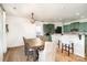 Dining room with farmhouse table and view of kitchen at 8003 Belmont Stables Dr, Charlotte, NC 28216