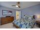 Serene bedroom featuring a wooden dresser and patterned bedding at 8502 Sagekirk Ct, Charlotte, NC 28278