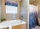 Bathroom with bathtub and shower at 910 Island Ford Rd, Maiden, NC 28650