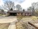 Brick house exterior with carport and a spacious backyard at 10035 Little Creek Rd, Mint Hill, NC 28227