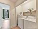 Convenient laundry room with washer and dryer at 10035 Little Creek Rd, Mint Hill, NC 28227