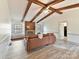 Living room features hardwood floors, a fireplace, and exposed beams at 10035 Little Creek Rd, Mint Hill, NC 28227