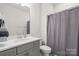 Clean bathroom with shower/tub combo and gray vanity at 111 N Shayna Rd, Troutman, NC 28166