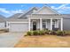 Gray siding craftsman style home with front porch at 111 N Shayna Rd, Troutman, NC 28166