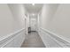 Bright hallway with wood-look floors and wainscoting at 111 N Shayna Rd, Troutman, NC 28166