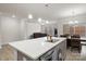 Modern kitchen with white quartz island and gray cabinets at 111 N Shayna Rd, Troutman, NC 28166