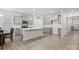 Open kitchen with gray cabinets, island, and white countertops at 111 N Shayna Rd, Troutman, NC 28166