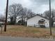 The church has ramp access, featuring mature trees and overcast sky at 1319 7Th St, Statesville, NC 28677