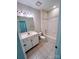 Bathroom with white vanity, bathtub, and tiled floors at 14243 Richmond Park Ave, Charlotte, NC 28277