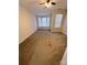 Bedroom with bay window, neutral carpeting, and ceiling fan at 14243 Richmond Park Ave, Charlotte, NC 28277