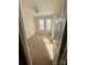 Well-lit bedroom with neutral carpeting and large windows at 14243 Richmond Park Ave, Charlotte, NC 28277