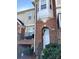 Brick front exterior of townhome with entrance and small balcony at 14243 Richmond Park Ave, Charlotte, NC 28277