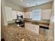 Modern kitchen with granite countertops and stainless steel appliances at 14243 Richmond Park Ave, Charlotte, NC 28277