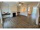 Spacious living room with fireplace and hardwood floors at 14243 Richmond Park Ave, Charlotte, NC 28277