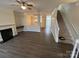 Living room with hardwood floors, fireplace, and staircase at 14243 Richmond Park Ave, Charlotte, NC 28277