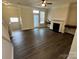 Open living room featuring hardwood floors and fireplace at 14243 Richmond Park Ave, Charlotte, NC 28277