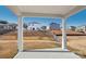 Covered patio overlooking a landscaped backyard at 1535 Harper Landing Blvd, Stanley, NC 28164