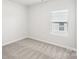 Spacious bedroom with neutral wall and carpet, and a window with blinds at 1535 Harper Landing Blvd, Stanley, NC 28164