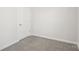 Empty bedroom with neutral walls and carpet, and a door at 1535 Harper Landing Blvd, Stanley, NC 28164