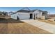 Two-story house with gray and white siding, and a driveway at 1535 Harper Landing Blvd, Stanley, NC 28164