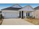 Two-story house with white siding, gray accents and a covered porch at 1535 Harper Landing Blvd, Stanley, NC 28164