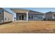 Gray house exterior with covered patio and backyard at 1535 Harper Landing Blvd, Stanley, NC 28164