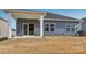 Gray house exterior with covered patio and backyard at 1535 Harper Landing Blvd, Stanley, NC 28164