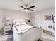 Bright bedroom with a white upholstered bed, nightstands, and artwork at 18015 Kings Point Dr # F, Cornelius, NC 28031