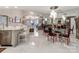 Modern dining room with glass table and red chairs at 18015 Kings Point Dr # F, Cornelius, NC 28031