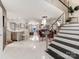 Elegant entryway with marble floors and modern staircase at 18015 Kings Point Dr # F, Cornelius, NC 28031