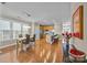 Open dining room with hardwood floors and kitchen island view at 18119 Coulter Pkwy, Cornelius, NC 28031